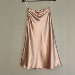 Soft light peach high waisted satin midi skirt with side zipper
